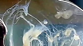 Guy cums in a condom filled with water