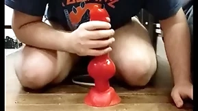 I play with my huge dilto and i cum relating to my chastity cage