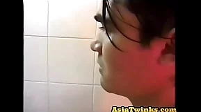 Asian twunk enjoys stroking his unshaven shaft in bathroom